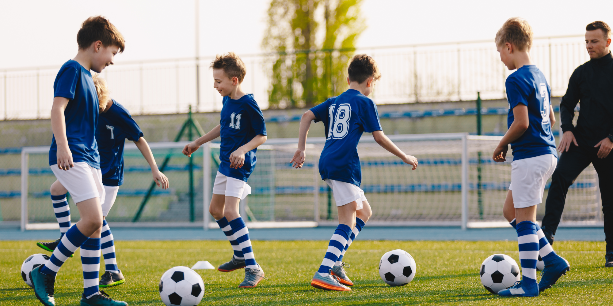 Photo of children playing football